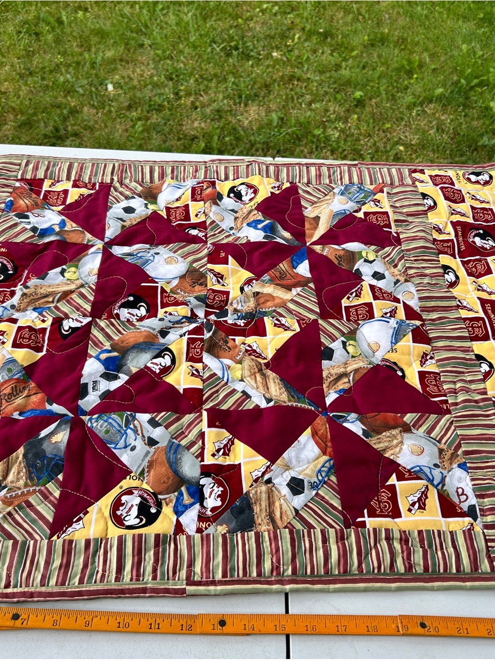 Sports-Themed Maroon and Yellow Patchwork Quilt